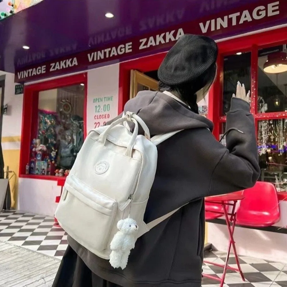 zaino-scolastico-grande-capacita-in-nylon-con-cerniera-borsa-per-ragazze-vari-colori-spazioso-con-ciondolo-per-adolescenti