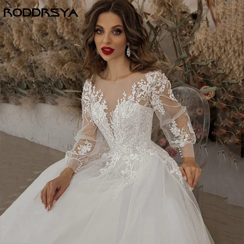 RODDRSYA فساتين زفاف عاجية أكمام طويلة مزين بالدانتيل مغرفة رقبة خط تول-فستان عروس بوهو vestido de noiva BeachRoddrsya عاج عرس ثوب كم طويل Appliques رباط عنق مستدير حرف واحد فقط ثوب الزفاف بوهيميا 2024 شاطئ أسود