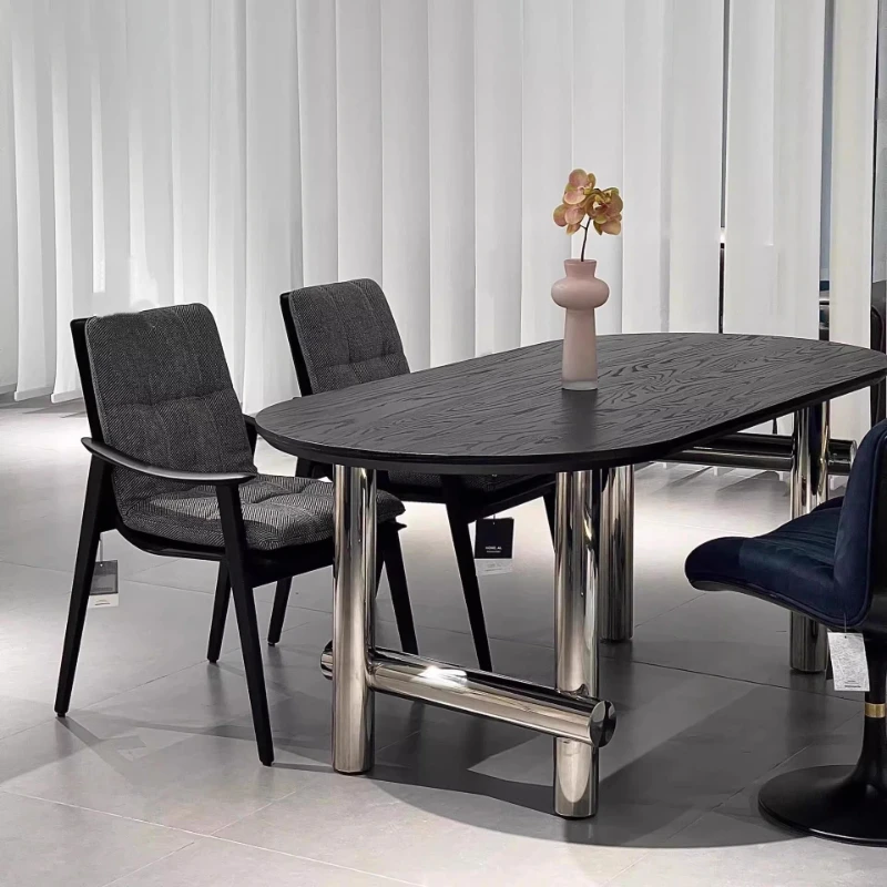 

Medieval rock slab dining table, modern simple light luxury small apartment stainless steel oval dining table, wabi **** bed and