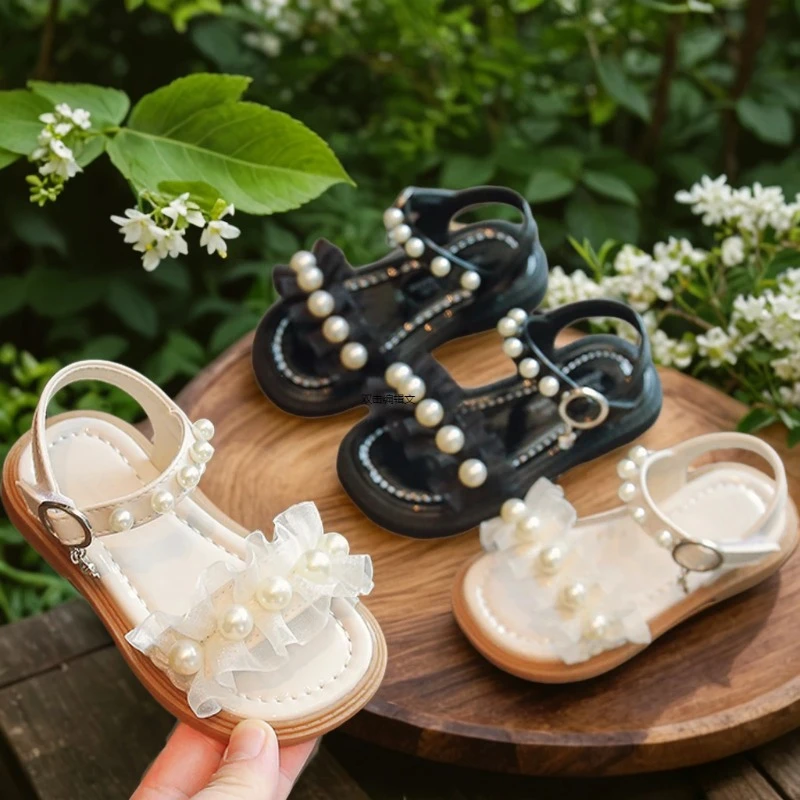

Новые элегантные сандалии для девочек, детские кружевные плиссированные сандалии принцессы, летние модные детские сандалии на плоской подошве с открытым носком и жемчугом, хит продаж