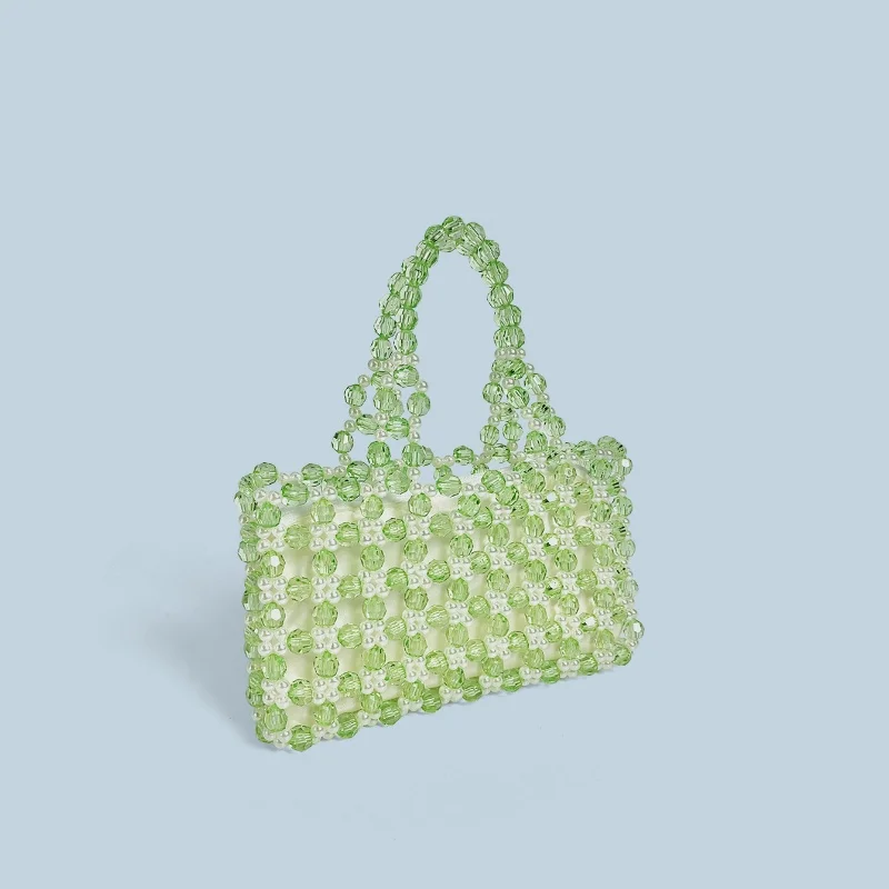 2025 صيف جديد الأخضر كريستال أكريليك اليدوية مطرز حقائب النساء العصرية عادية بلون اليد المنسوجة عطلة حقيبة حمل على الشاطئ حقيبة