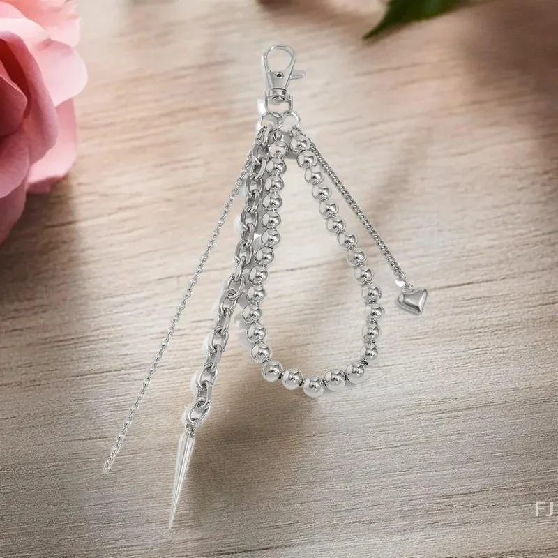 سلسلة مفاتيح أنيقة بشرابة فاسق للجنسين؛ معدن مستدير من الخرز الفضي؛ ملحق بإبزيم حزام الزوجين وديكور الحقيبة.