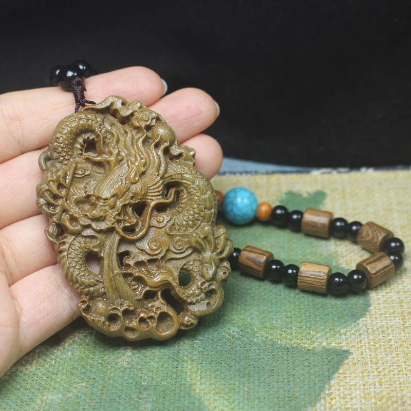 Green sandalwood carved dragon pendant car accessory, solid wood pendant, hand-held ornament, collectible item with a pleasant f