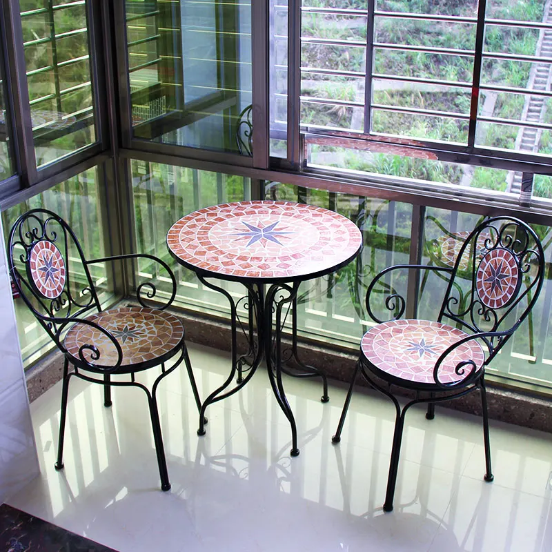 Wrought iron balcony, casual mosaic table and chair combination, European room, outdoor courtyard garden