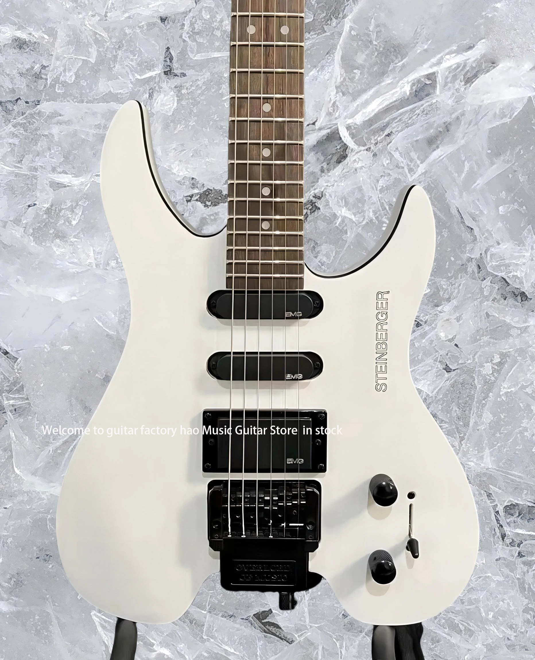 جيتار كهربائي بدون رأس، جسم الماهوجني، جسر فلويد روز تريمولو، جيتار مكون من 6 أوتار، إصدار شتاينبرغ