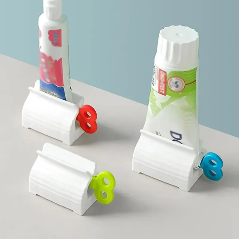 Toothpaste Holder Rolling Tooth Paste Squeezer Toothpaste Dispenser Tube Squeezer Facial Cleanser Press Bathroom Accessories