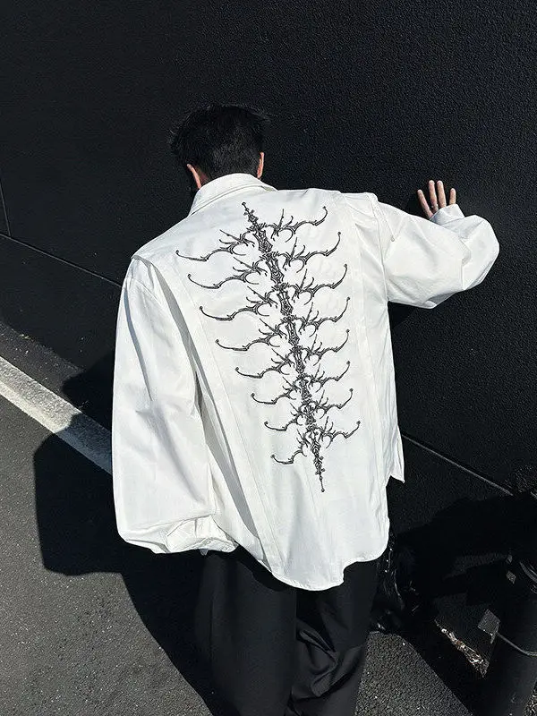 

Мужская рубашка Ele American Sle Long Sleeve с вышивкой, аппликацией, узором «змеиный глаз», элементами в виде позвоночных костей и бусин, весенняя коллекция CleanFit