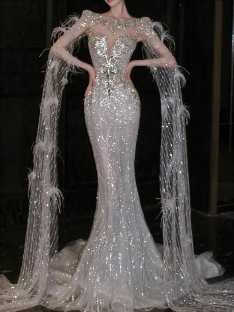 

The host will toast beaded strapless and models walk runway with shawls girl wear a dress