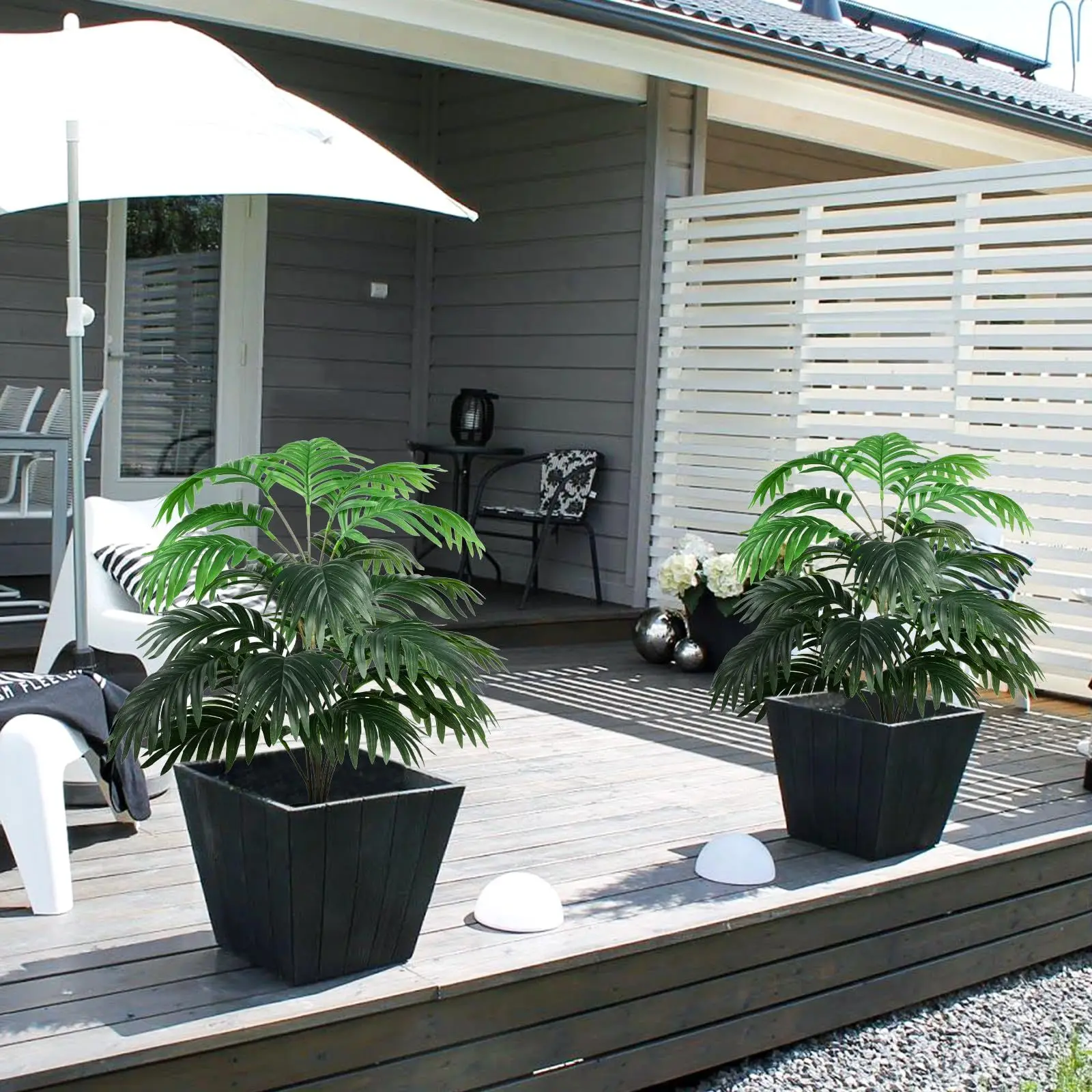 

Реалистичное искусственное зеленое растение с длинными стеблими и большими листьями для внутреннего и наружного декоративного использования.