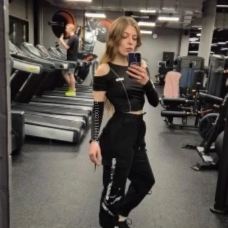 أنثى الشارع ملابس رقص أعلى قصيرة شبكة سوداء قاعدة قميص طويل الأكمام أعلى جوفاء خارج قبالة الكتف تي شيرت للنساء