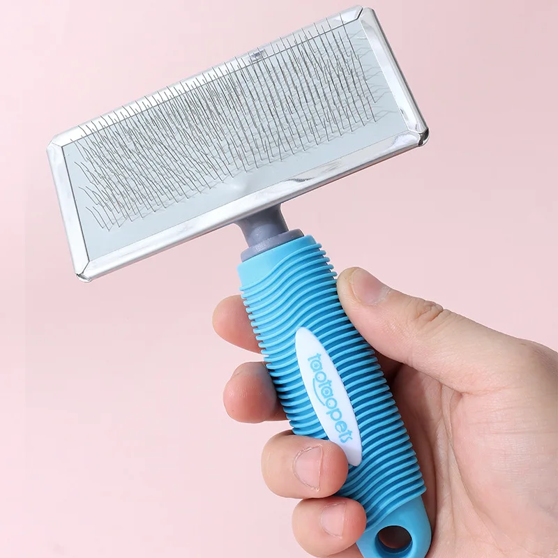 Durable pet grooming brush comes with a pet grooming brush that effectively reduces shedding and eliminates knots on cat and dog