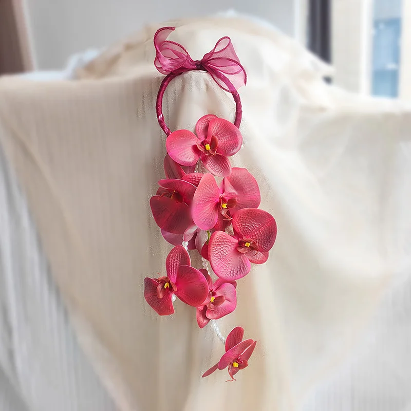 

Chinese red Phalaenopsis hand holding flower amine pendant bride wedding photography writing simulation flower home wall