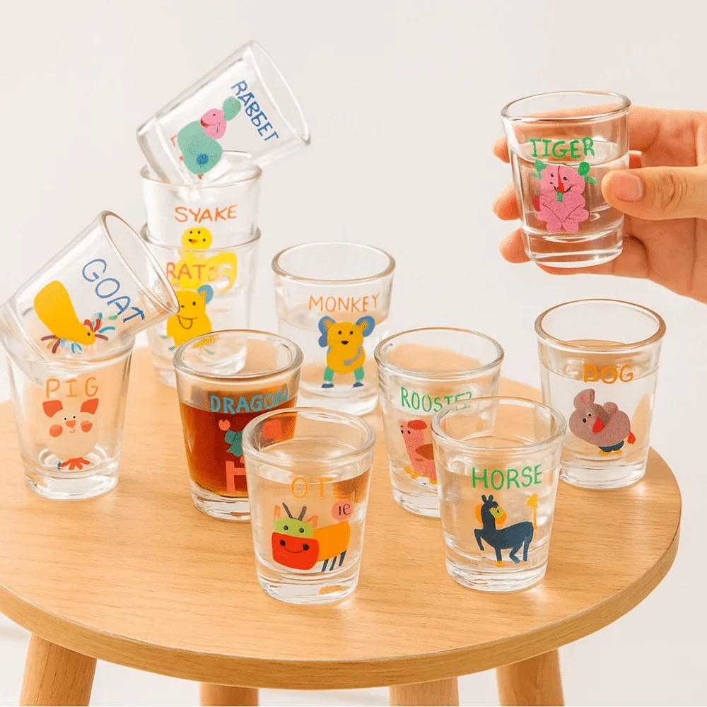 

12Pcs Unique Creative Cocktail Cup Set 50ml Chinese Zodiac Clear Juice Cups Thickened Visible Cartoon Glass Cup Household
