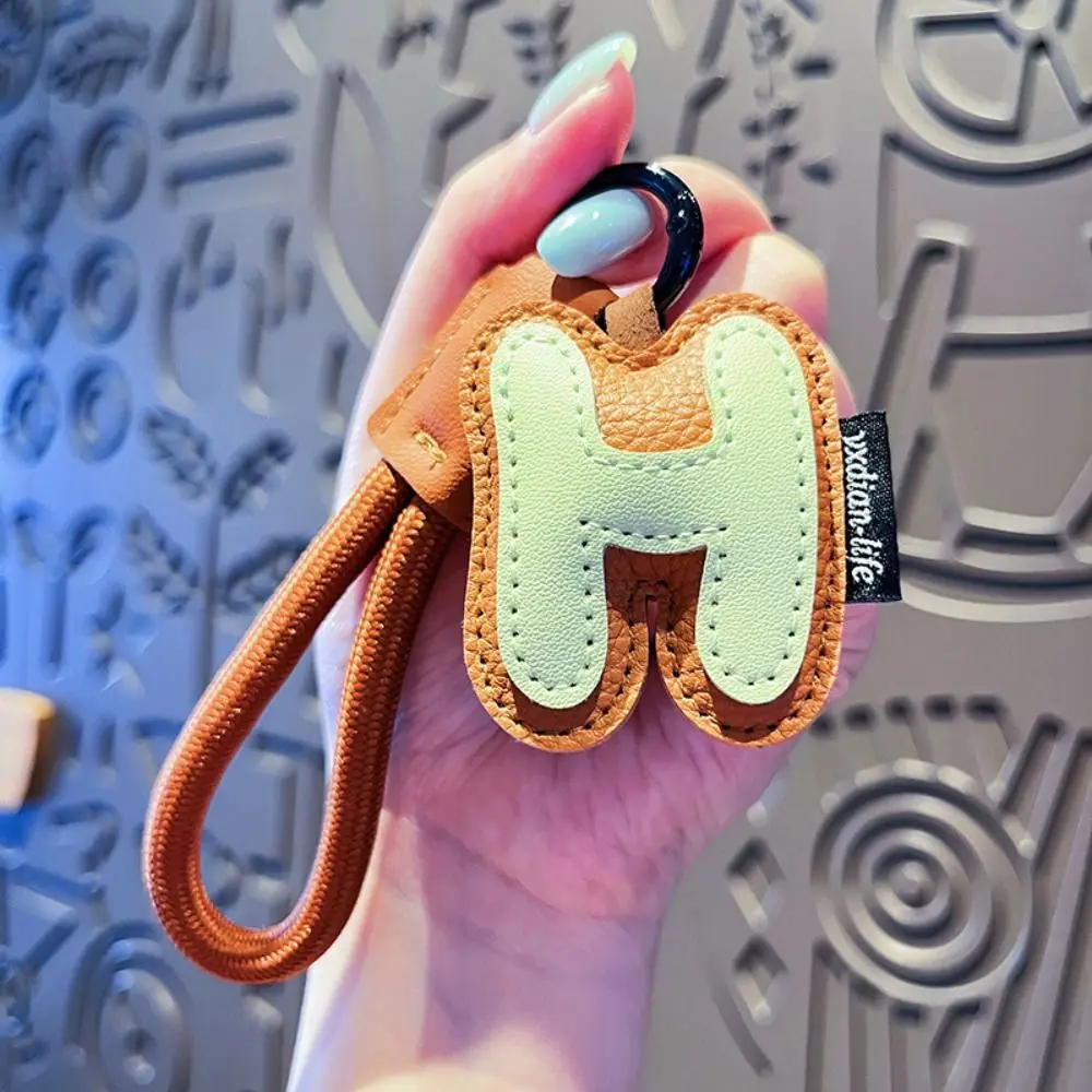 

Милый 26-летний брелок для ключей, сумка, подвесные подвески, искусственная кожа, брелок для ключей с алфавитом, автомобильный брелок, украшения, подвеска счастливой буквой для мальчика