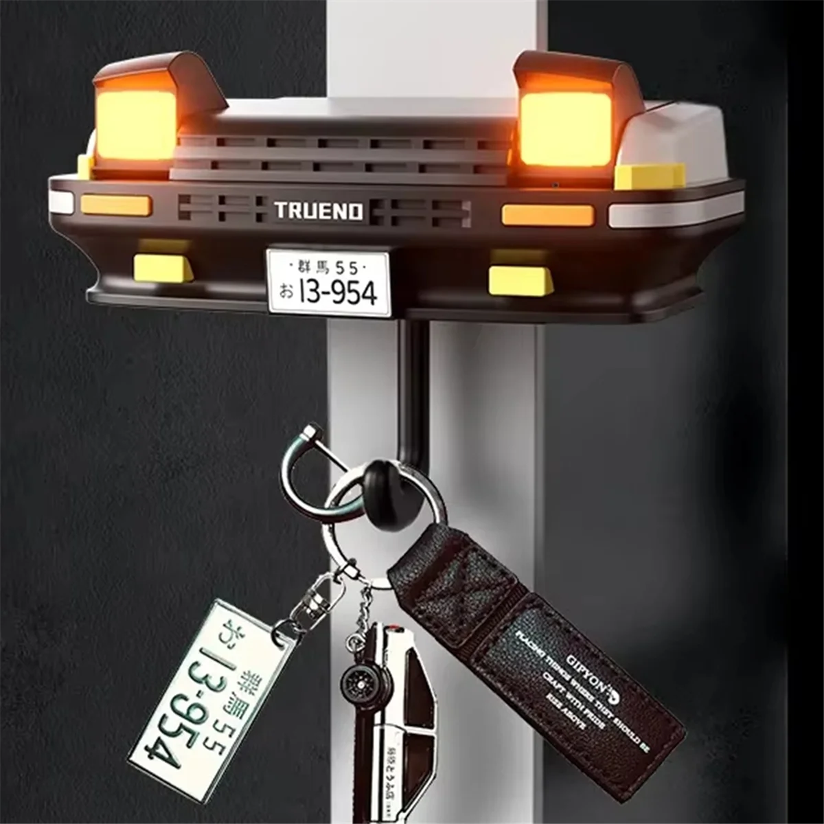 AAA87 Llavero de coche Decoración Gancho de llave montado en la pared Gancho de llave de faro para regalos de entusiastas del automóvil Negro