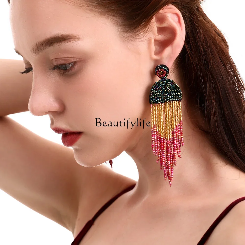 

Rice bead fringed earrings Bohemian retro ethnic style exaggerated personality handmade earrings