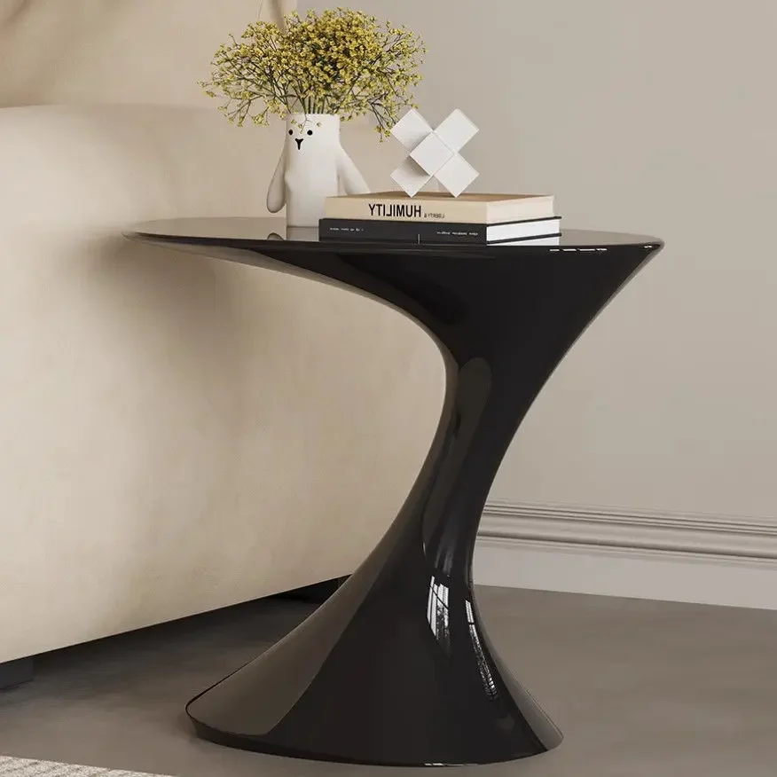 Sleek Black Modern Side Table with a Sculptural Silhouette, Elevating the Aesthetic of Any Living Space
