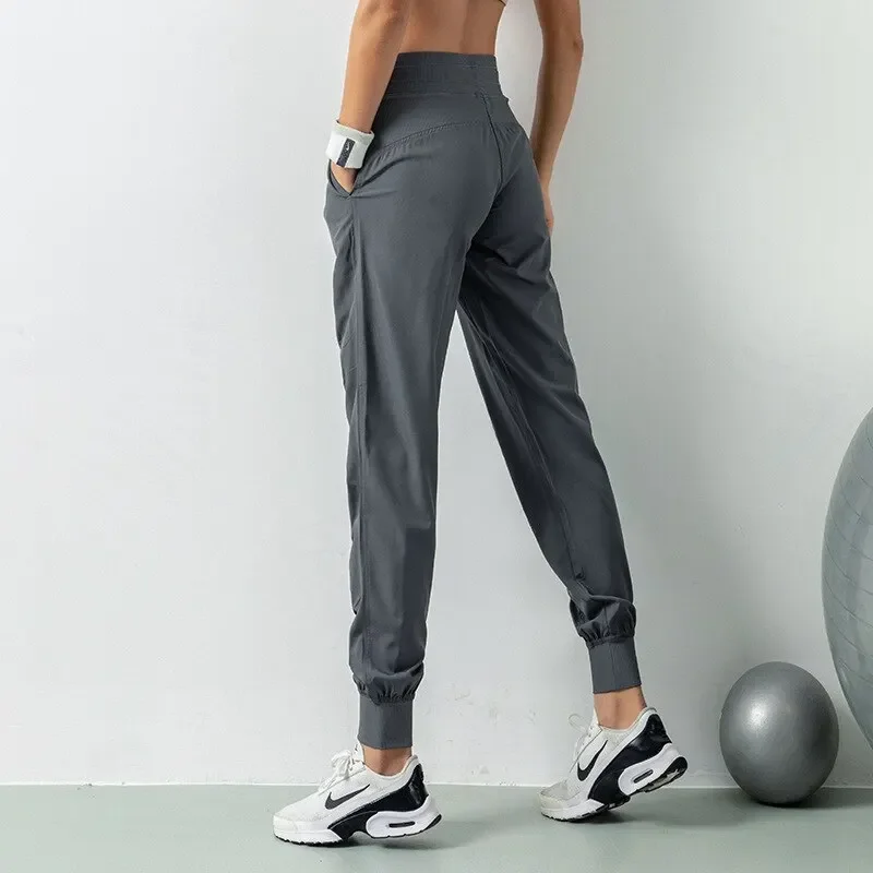Pantaloni sportivi da corsa con coulisse in tessuto Pantaloni sportivi da donna per palestra atletica ad asciugatura rapida con due tasche laterali Pantaloni da esercizio