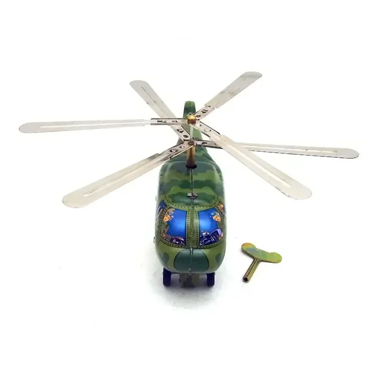 

Retro wind-up metal tin military helicopter airplane clockwork fun and nostalgic vintage toy perfect for collectors and gifts