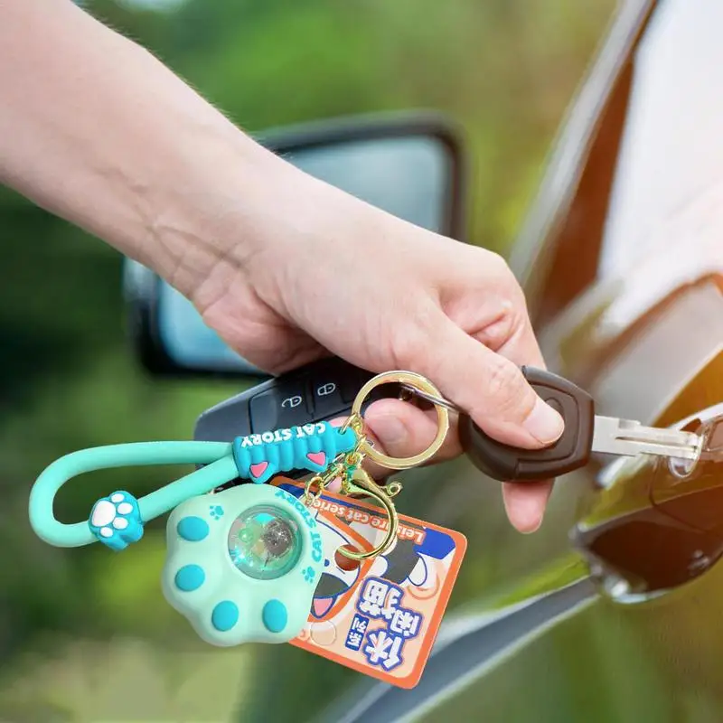 Llaveros de dibujos animados de PVC para mochilas, colgante de pata portátil y creativo con luz de puesta de sol para mochila, estuche de lápices móvil