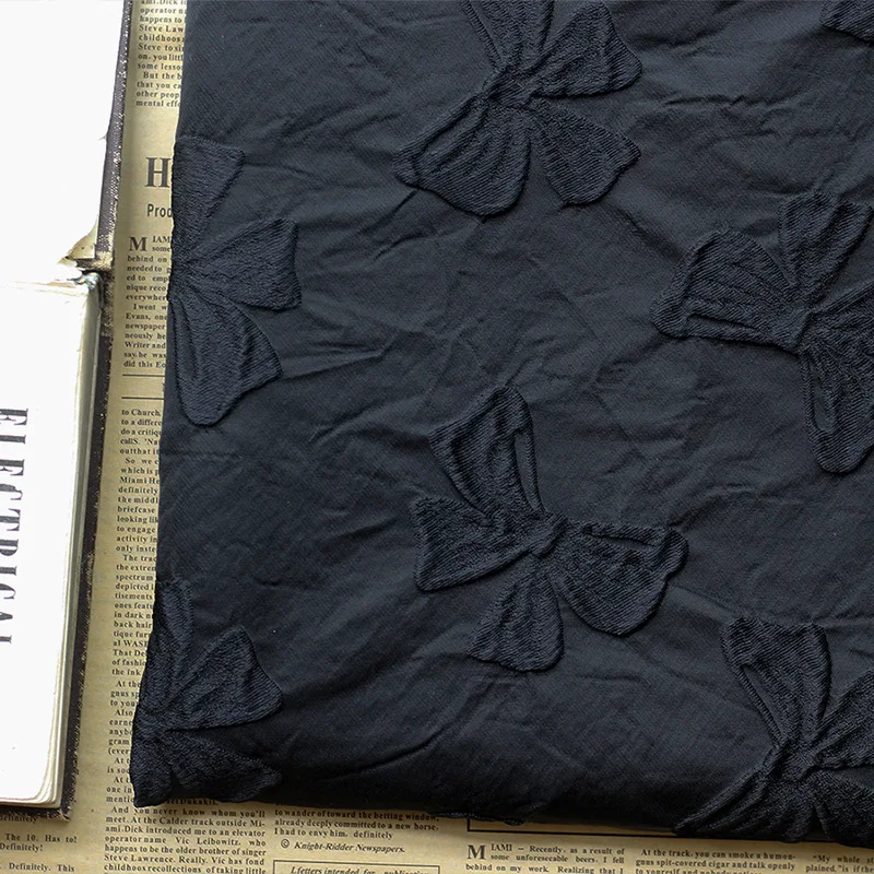 Yarn Dyed Embossed Black Bow Jacquard Fabric Stiff Polyester Autumn and Winter Jacquard Dress Fabric 45cmx140cm