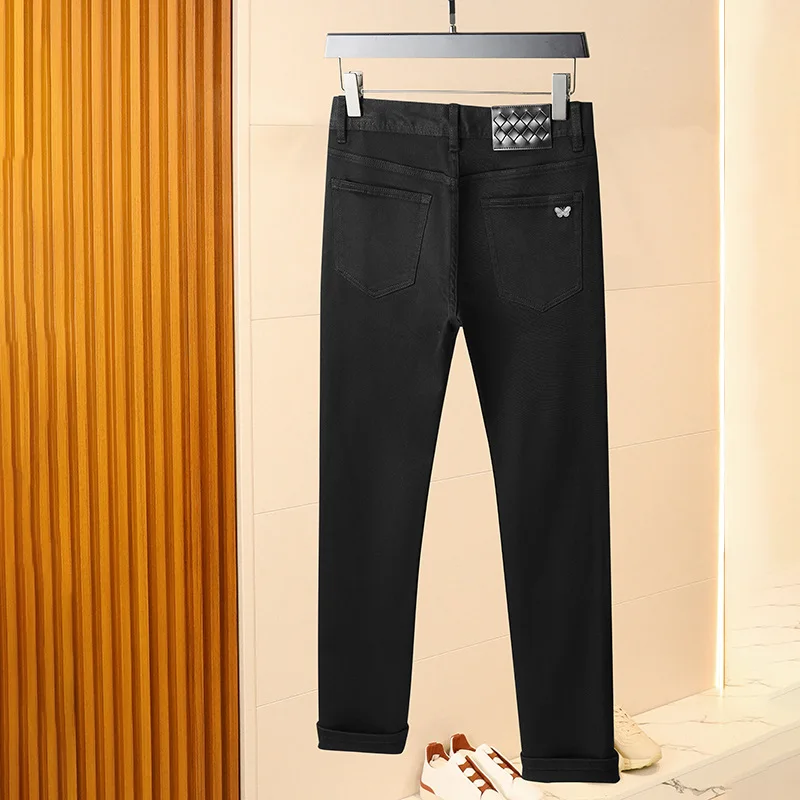 Pure black jeans men's 2025 new light luxury fashion spring and summer versatile elastic slim fit small straight leg pants