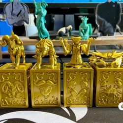 Originale Saint Seiya 4 pezzi Anime periferiche figure oro panno sacro Design decorazione uovo intrecciato scatola uovo Desktop regalo per bambini