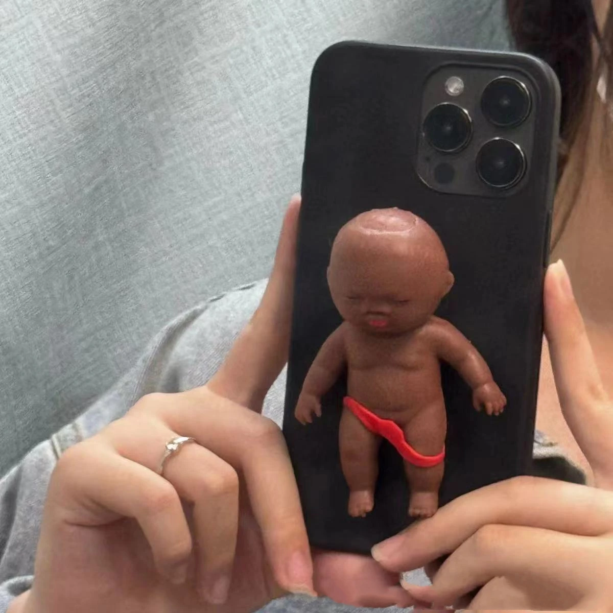 Interesting funny phone case black doll red shorts suitable for iPhone 1514 phone case all inclusive transparent 16 12 13promax