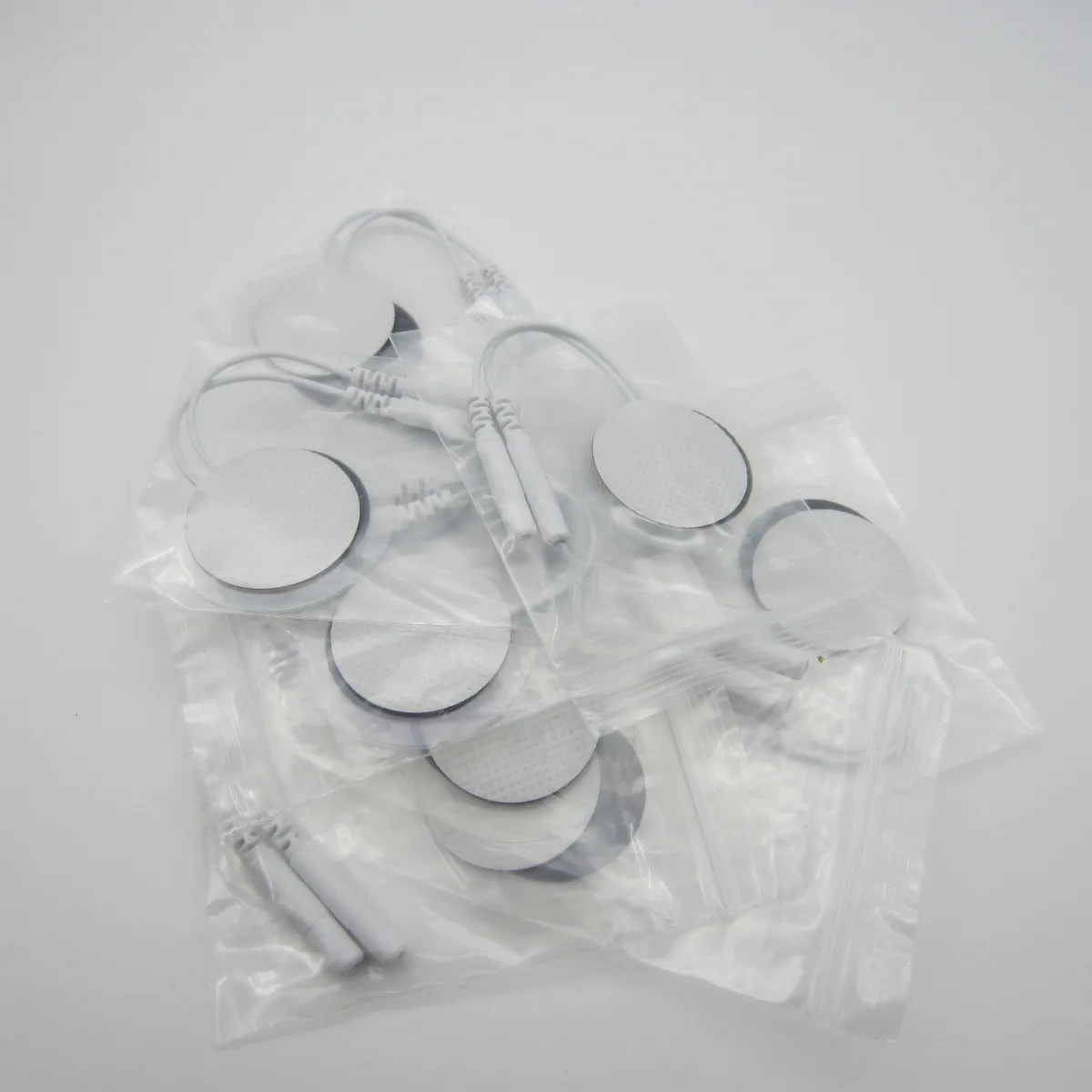 

50pcs/lot Tens EMS Acupuncture Slimming Self Sticker Therapy Machine Massager Round 30mm Electrode Pads