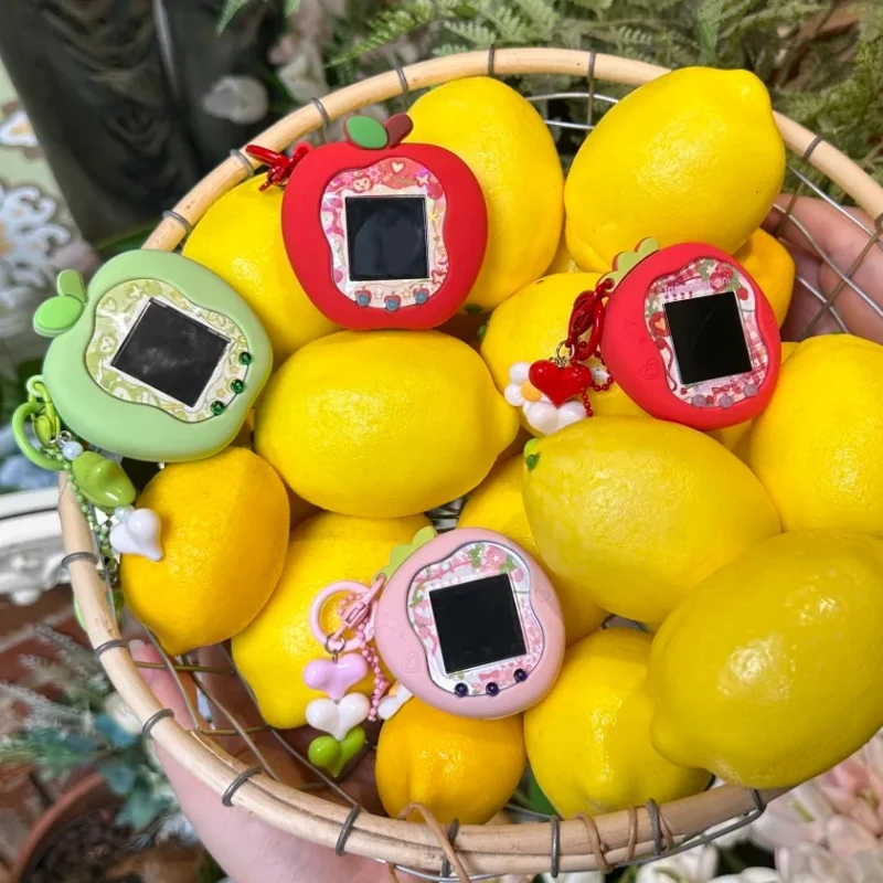 حافظة حماية من السيليكون من Tamagotchi Uni Smart Uni Pet Machine باللون الأخضر والأحمر Apple Uni مع أوراق لوحة وسلاسل المفاتيح وهدايا عيد الميلاد