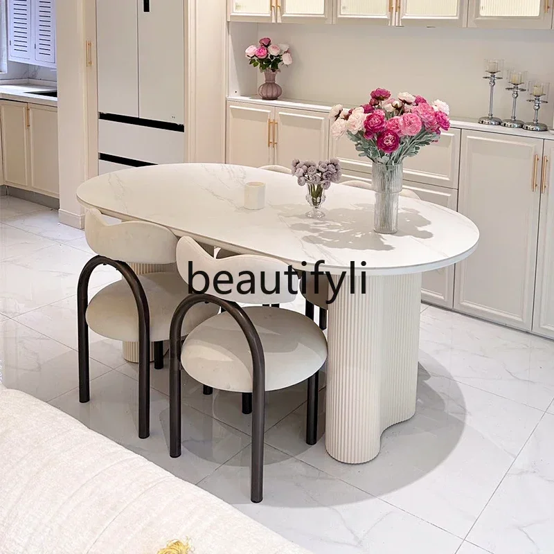 

French rock slab oval dining table light luxury high-end modern simple wabi style dining table and chair combination