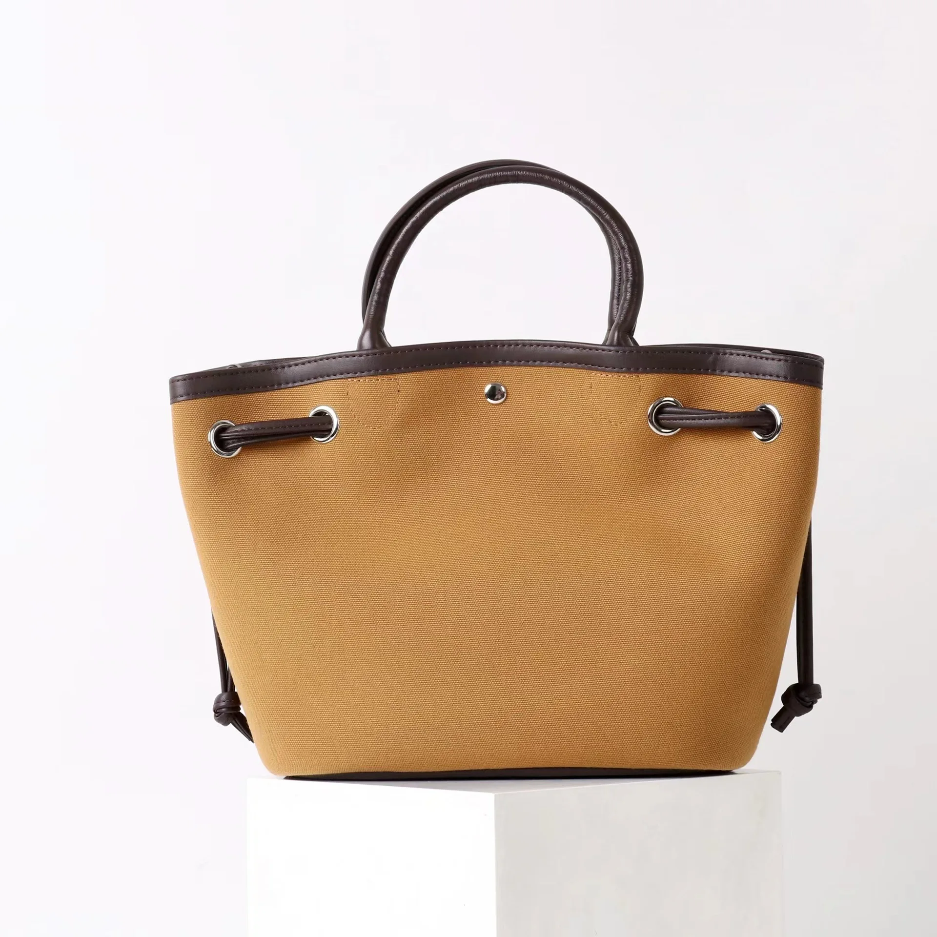 

Canvas with cowhide drawstring vegetable basket bag 2025 new niche design casual and fashionable ladies one-shoulder handbag