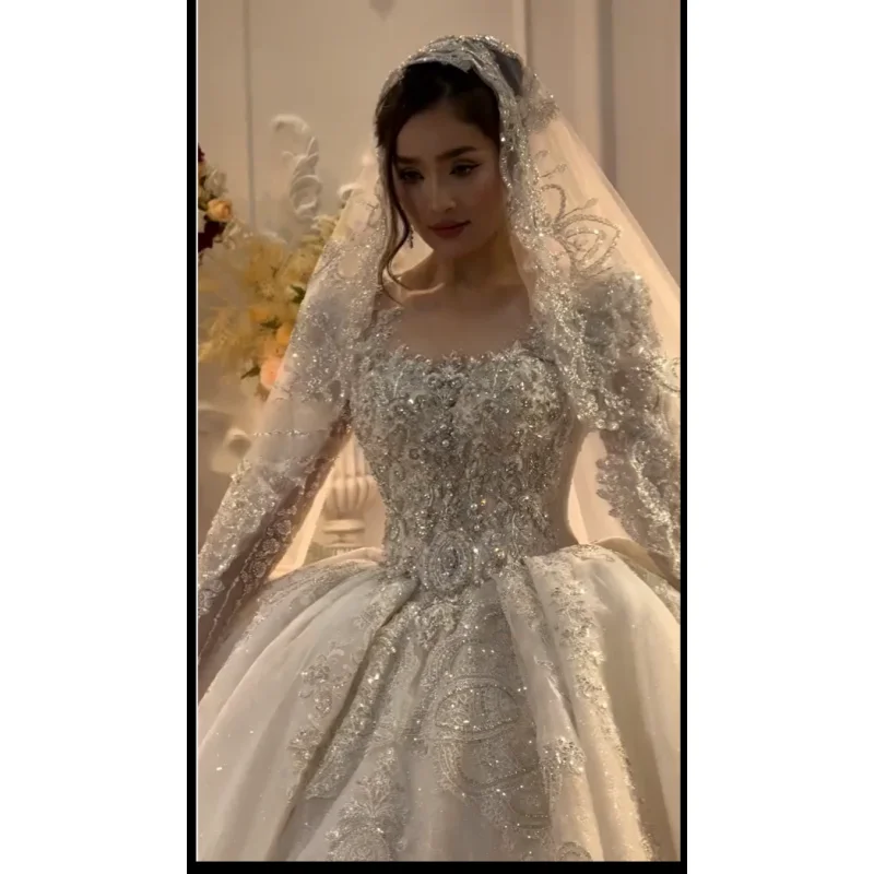 Customized luxury large skirt princess dress wedding dress lace pearl sequin decoration round neck long sleeved Vestido De Noiva