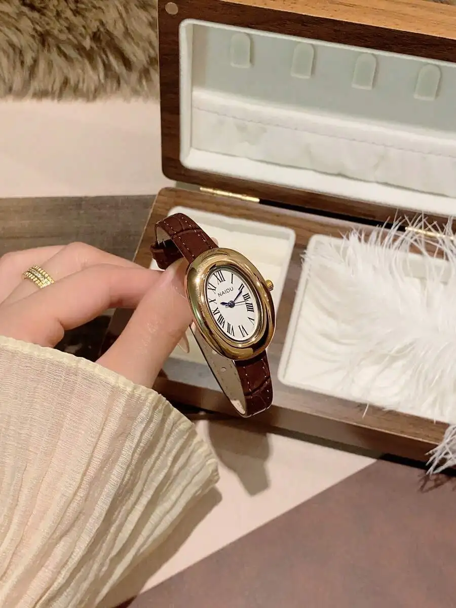 

Элегантные овальные кварцевые часы с римскими цифрами и коричневым кожаным ремешком