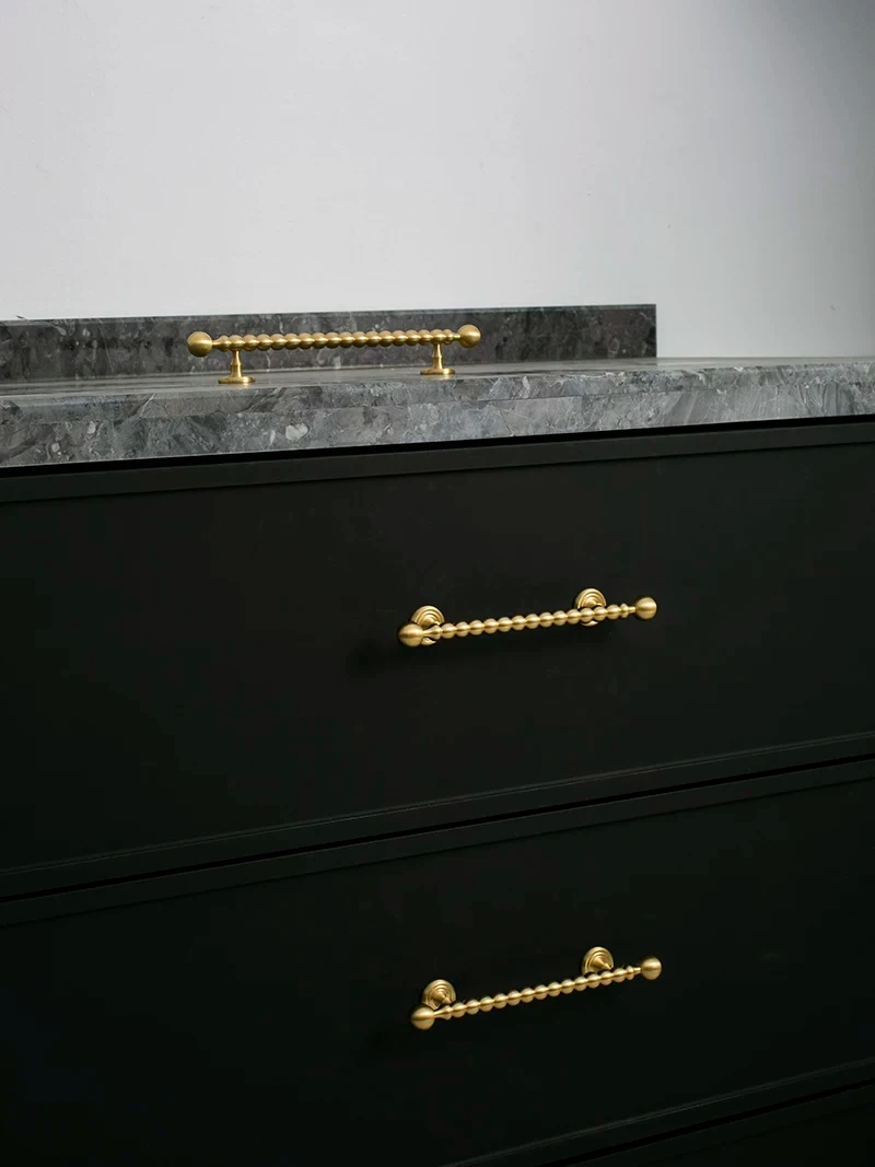 Beaded cabinet handle in brushed brass shown in the supplier product illustration 21
