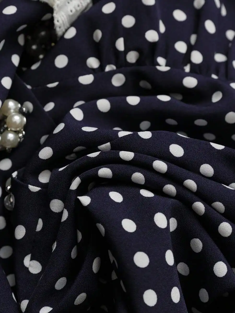 

Blue And White Polka Dot Wrap-Style V-Neck Dress With Short Sleeves And Elasticated Waist