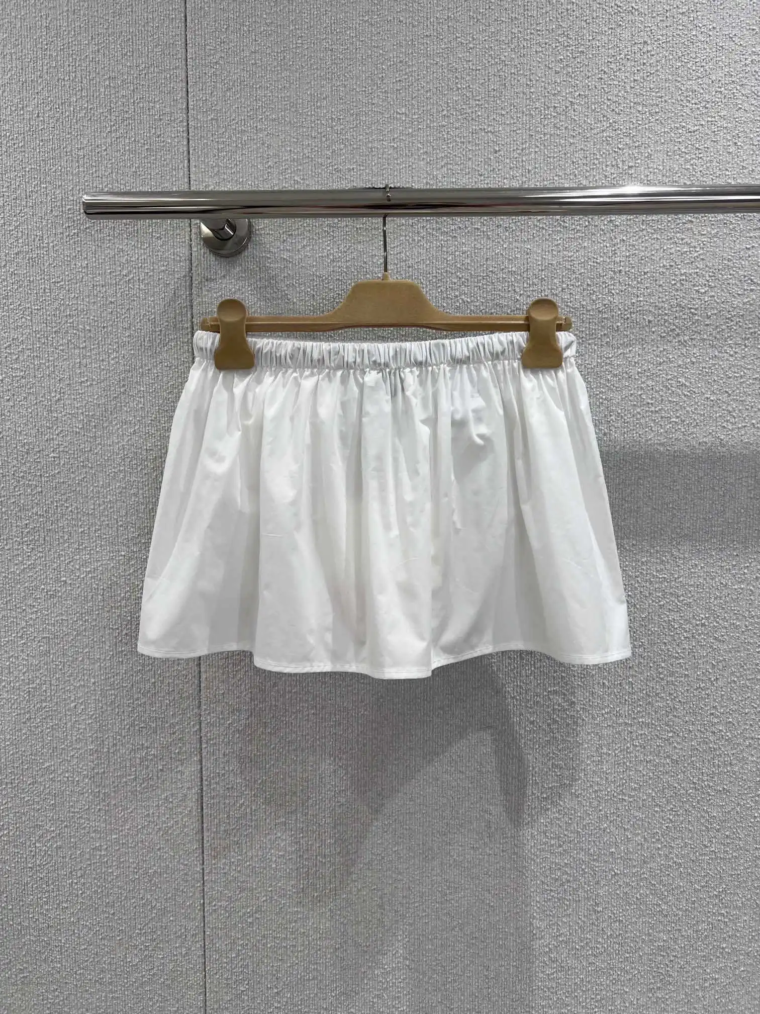 2026 Spring/Summer New Fashionable and Elegant Extremely Simple silhouette Letter Logo Pocket Mini Half Skirt Women's Wear