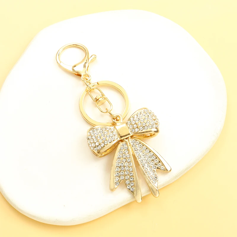 LLavero de diamantes de imitación con forma de lazo para mujer, accesorios de llaves de cartera de bolso dulce Kpop, joyería exquisita para Interior de coche, llavero de aleación