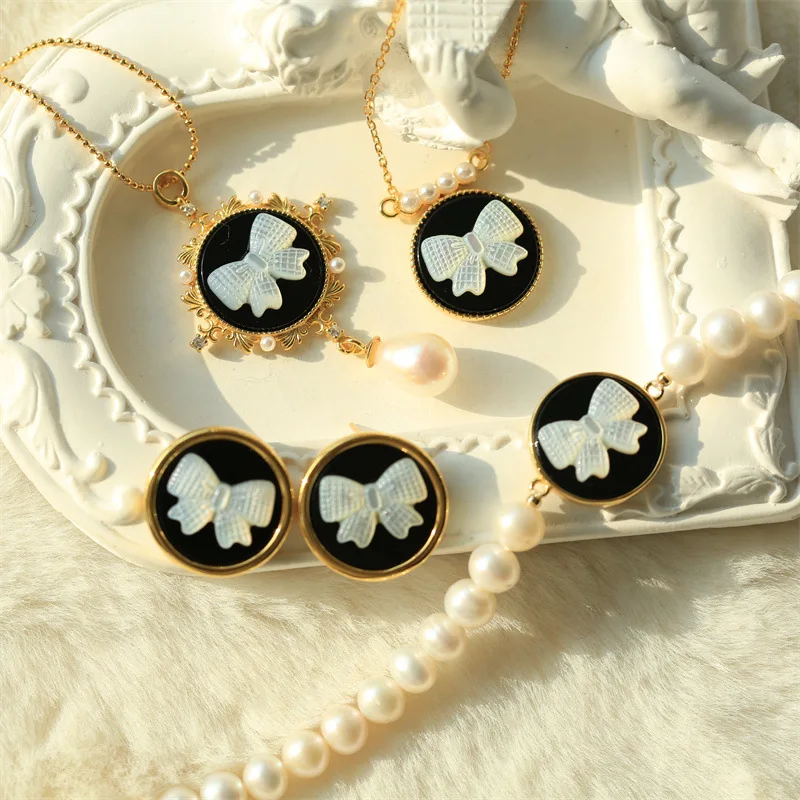 

S925 Silver Electroplated 18k Gold Inlaid with White Butterfly Shell Shell Engraving Bow Pendant Earrings Necklace