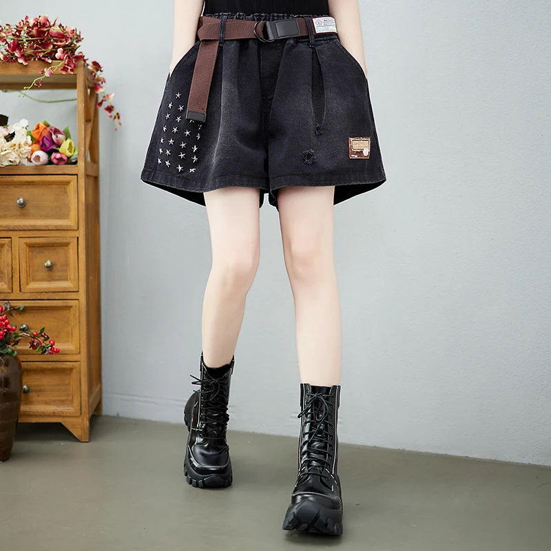 Moda solta feminina denim shorts de perna larga 2025 verão nova cintura alta nicho design exclusivo casual versátil jeans com cinto