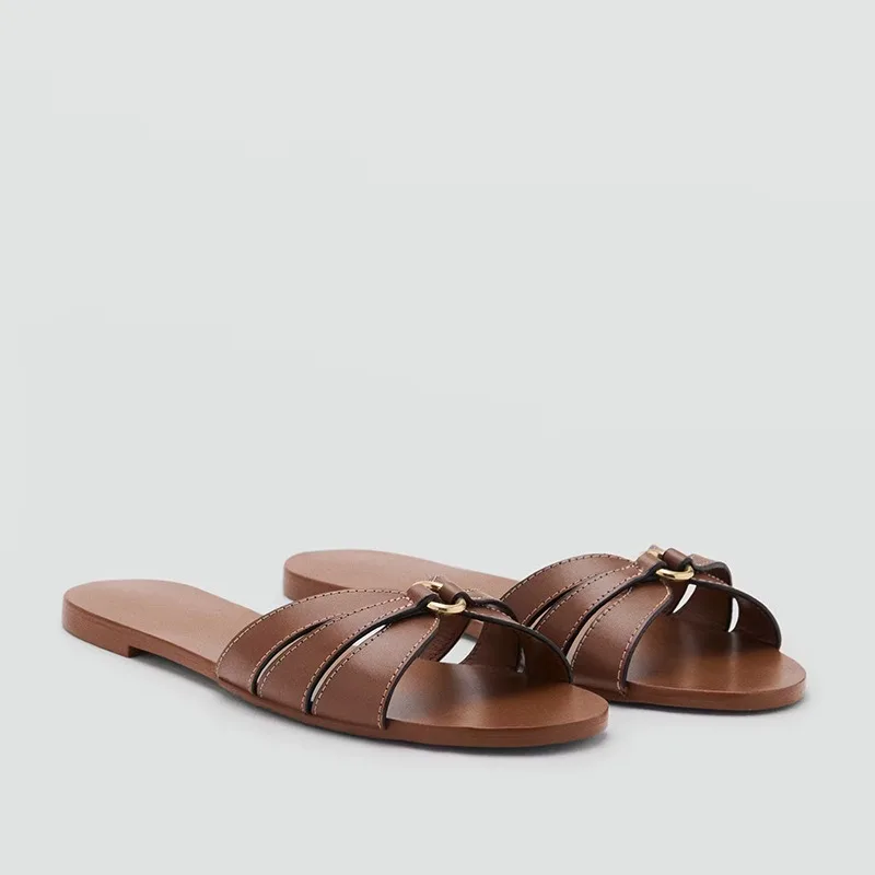 Slippers women's flat bottom 2026 summer new metal buckle beach shoes casual flat heel one word cool slippers women's outer wear