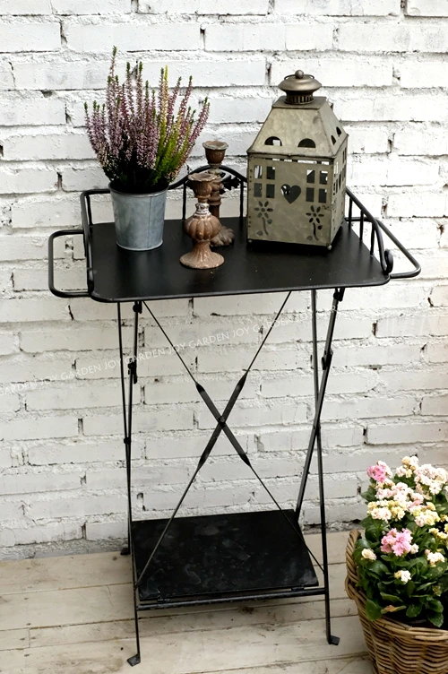 Old style wrought iron flower stand, console