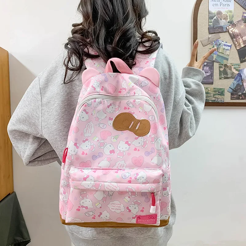 Sanli cartoon animation KT cat bow schoolbag casual backpack female commuter oblique span cute cat ear large capacity backpack