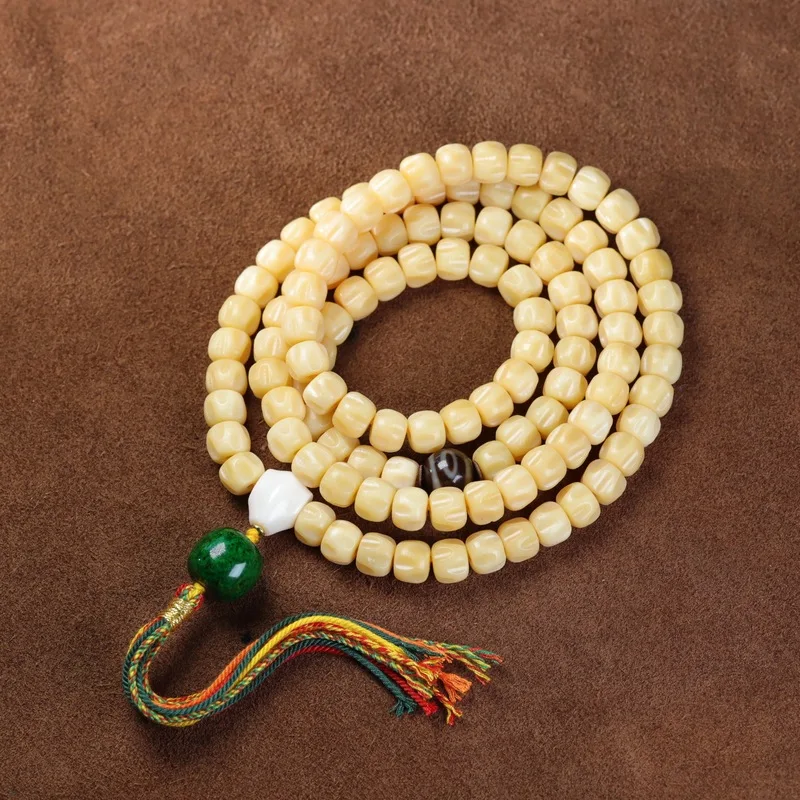 Natural jade-like passion fruit seeds used for making DIY bracelets and Buddhist prayer beads