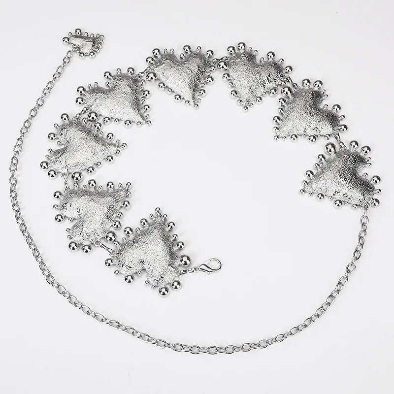A high-end women's waist chain — a bold metal belt featuring an oversized heart design, adding a unique and stylish touch