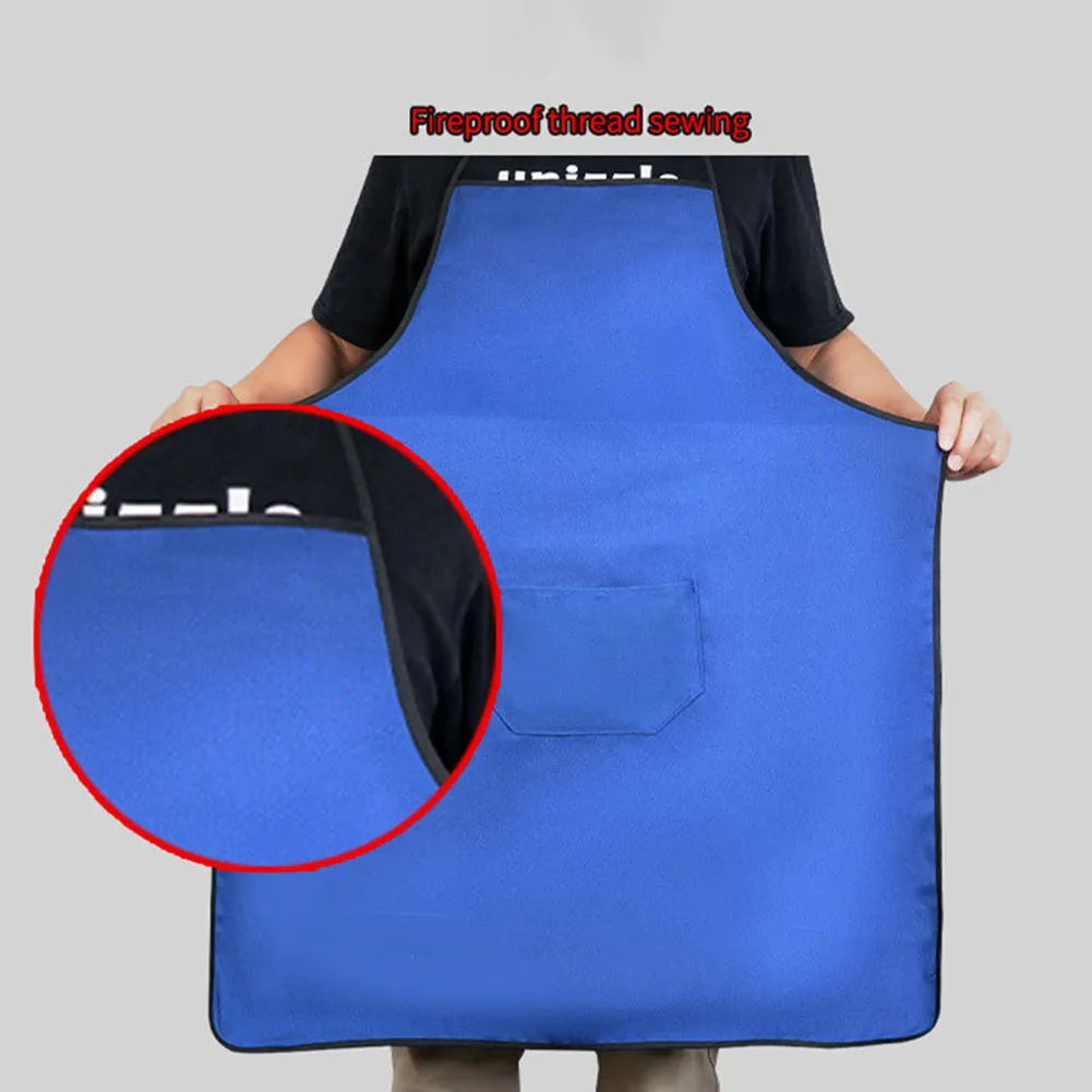 Fireproof welding apron with splash proof design and breathable polyester fabric equipped with a convenient pocket for tools