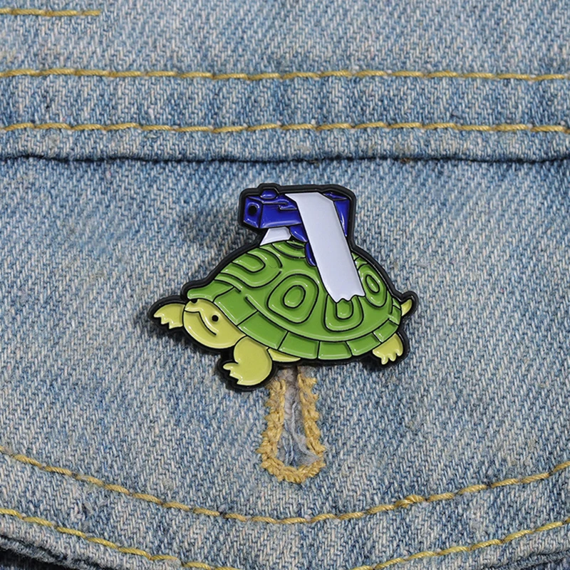 

Funny Turtle Enamel Pins Custom The Turtle With Gun Brooches Lapel Badges Animal Jewelry Gift for Kids Friends