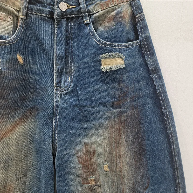 Spodnie damskie na jesień 2025, nowa moda, uniwersalne, wyszczuplające, luźne, z szerokimi nogawkami, jeansy w stylu vintage z efektem zniszczenia.