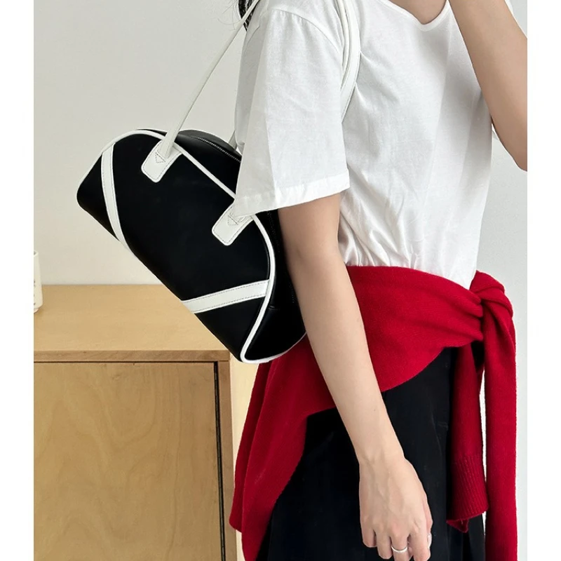 

Korean wind ins color collision shoulder bag large capacity female 2025 autumn new cross-border niche handheld bowling bags