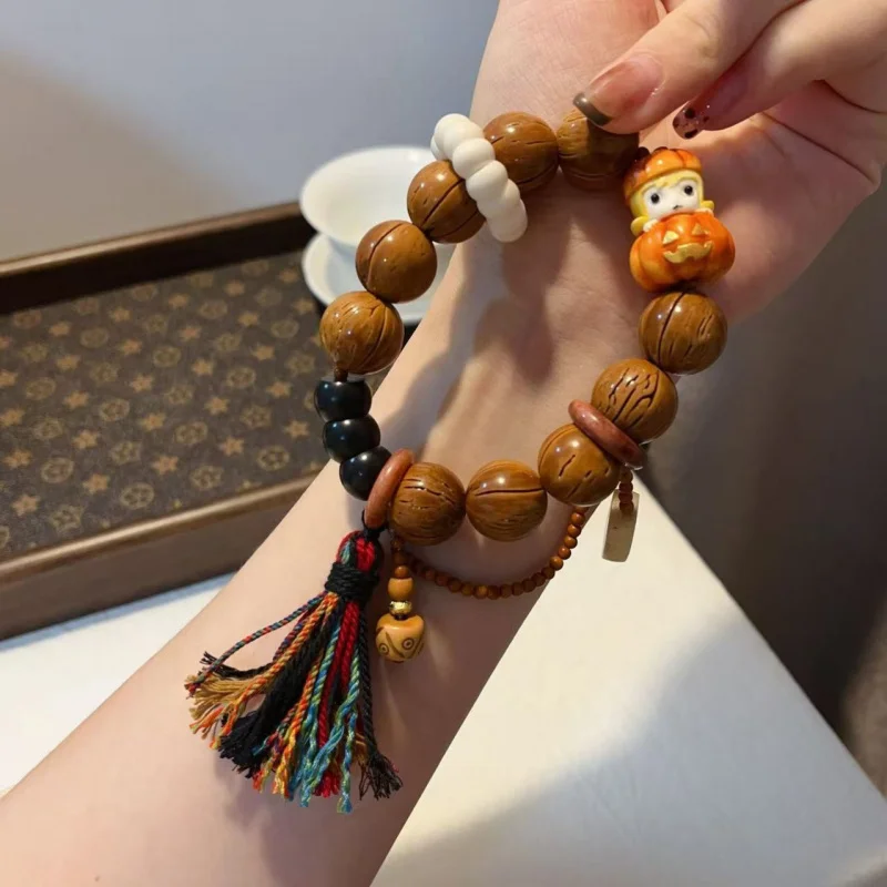 handmade walnut bracelet with deer antler pocket bear women holding Buddha beads
